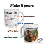 Two South West Coast Path mugs with numbered arrows showing what you can personalise: trail stats, your own words, your dates.