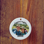 Photo version of Camino Inglés ornament in front of wooden door.