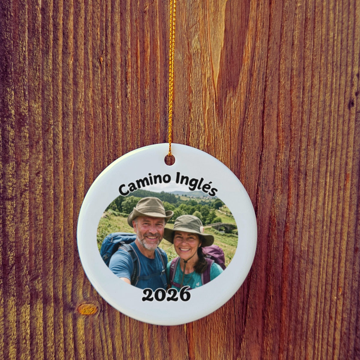 Photo version of Camino Inglés ornament in front of wooden door.