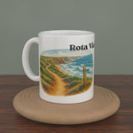Video of a white Rota Vicentina mug turning slowly, showing both editions: the watercolour map and the photo version.