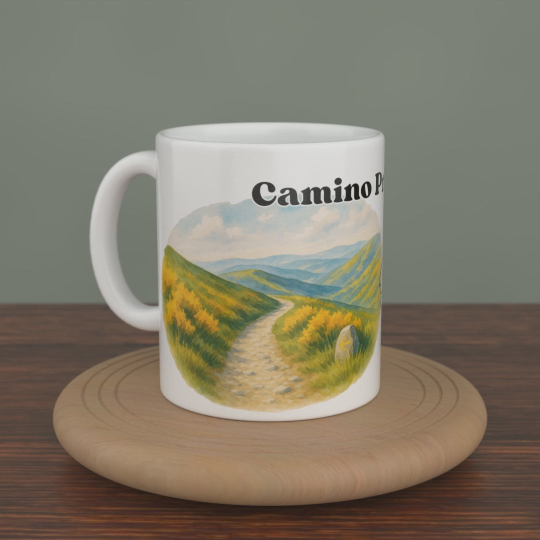 Video of a white Camino Primitivo mug turning slowly, showing both editions: the watercolour map and the photo version.